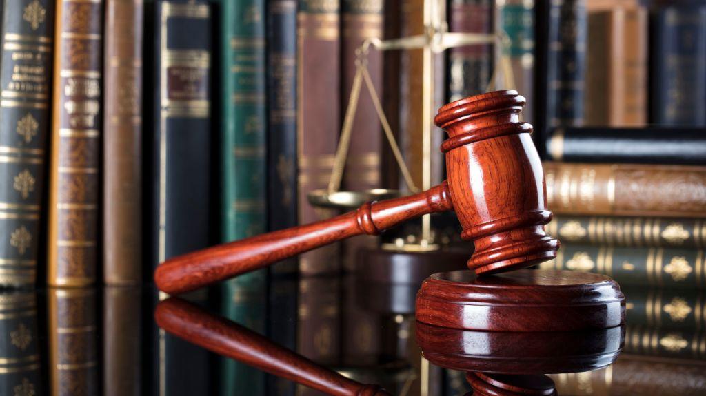 Gavel, Books and Scales of Justice on a Desk