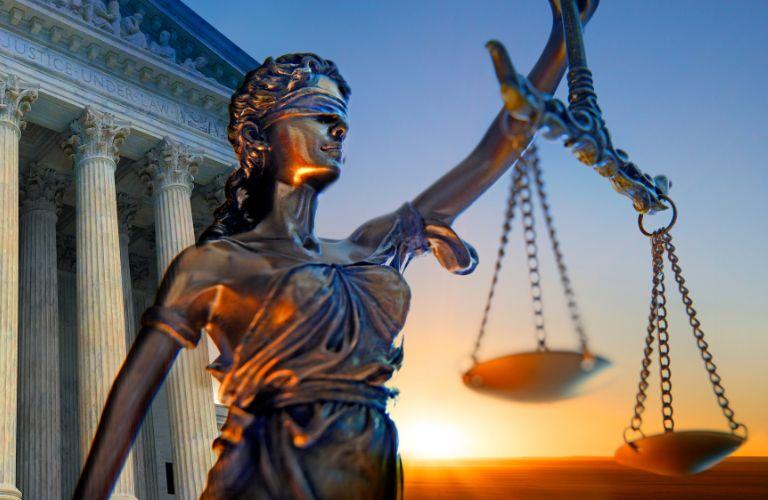 Blind Lady of Justice Statue at Sunset