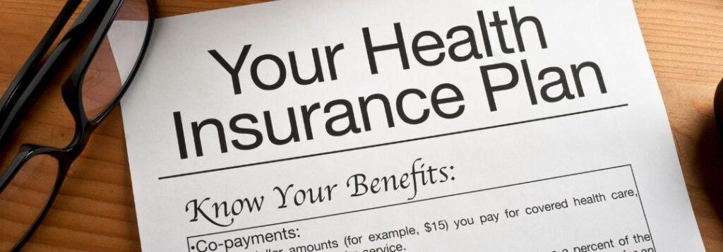 Health Insurance Documents on a Desk