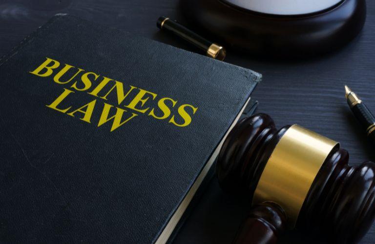 Black Business Law Book and Gavel on a Desk
