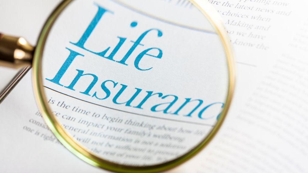 Magnifying Glass Over Blue Life Insurance Text