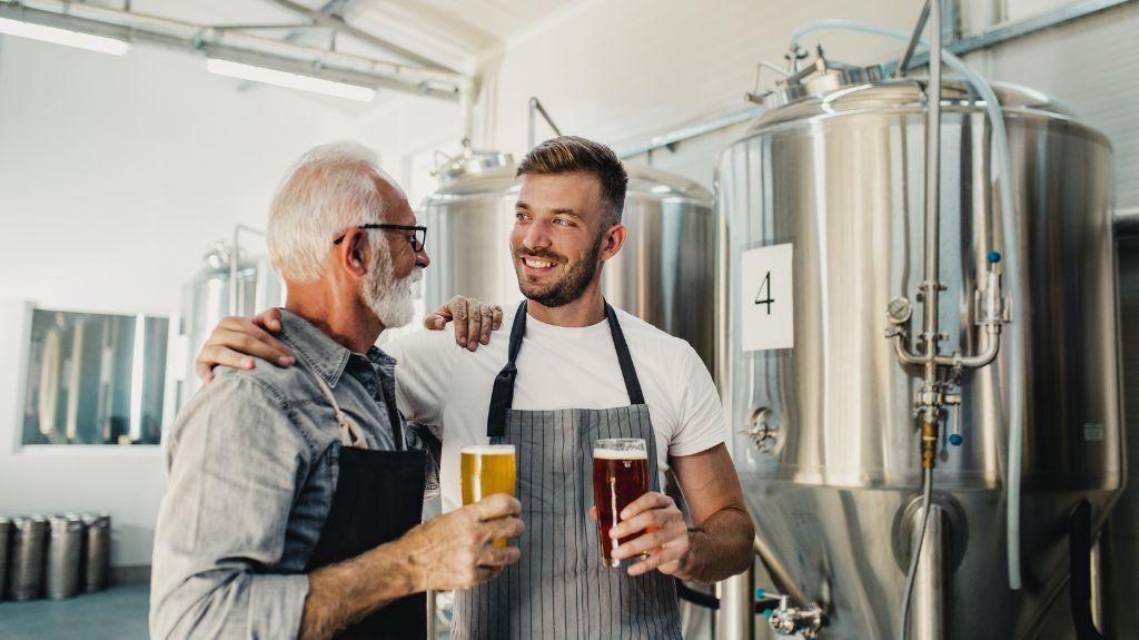 Two Brewers with Beer in a Microbrewery