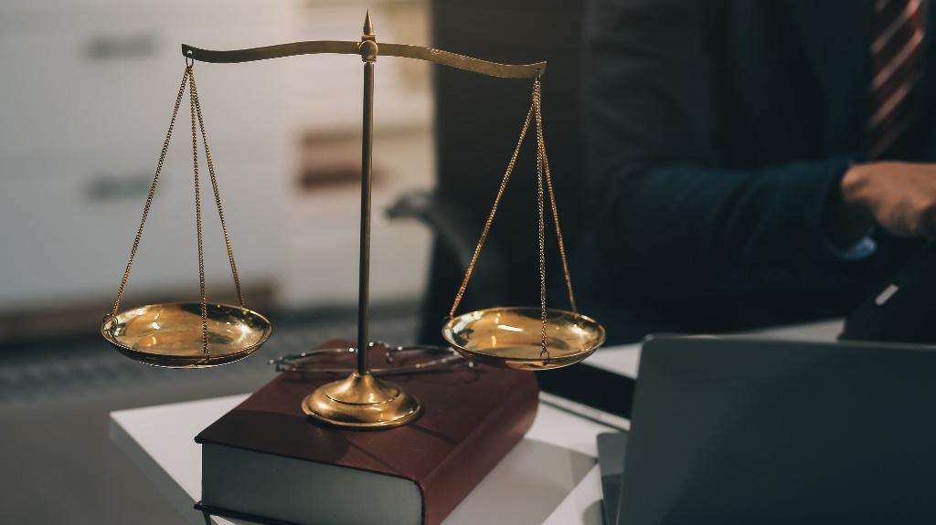 Justice scale with book underneath