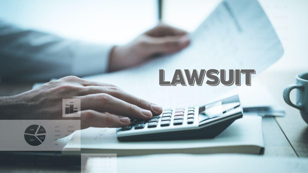 Lawyer with Documents and a Calculator with Dark Lawsuit Text Overlay